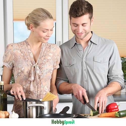 Picture of a man and woman cooking - Cooking Quotes