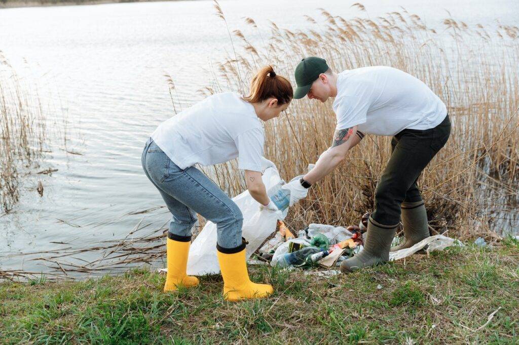Two People Cleaning up the River - Eco Friendly hobbies