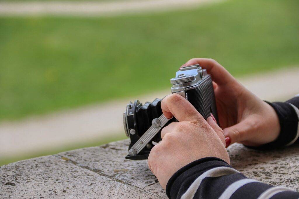 A Camera help by a hand - Hobbies For Nerds